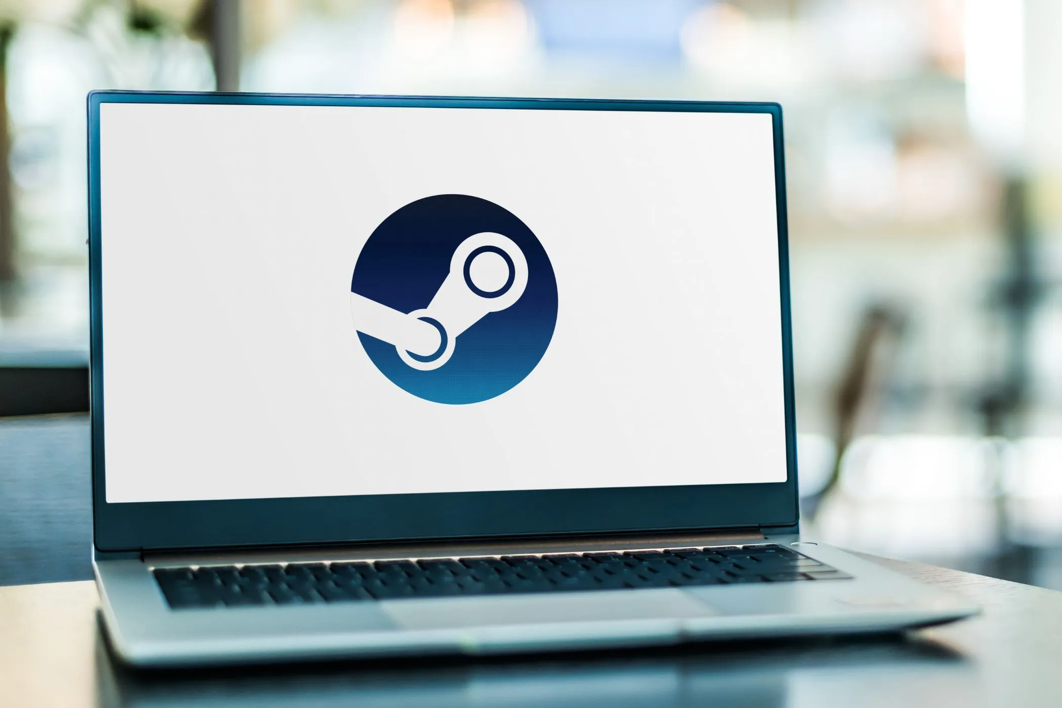 Màn hình máy tính xách tay hiển thị logo Steam, minh họa cho nền tảng chơi game trực tuyến khi người dùng cần liên hệ hỗ trợ hoặc khôi phục tài khoản