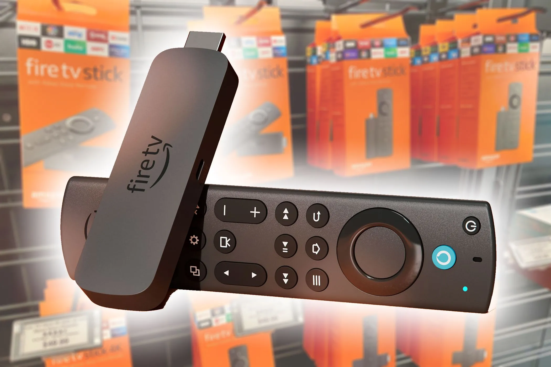 Thiết bị Amazon Fire TV Stick 4K Max nổi bật trên nền các hộp sản phẩm, thể hiện tính di động cao và tiện lợi khi mang đi
